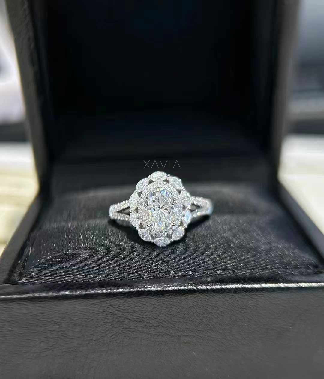 front view of Lunessence oval cut lab diamond engagement ring with floral halo cluster and pavé split shank setting in white gold